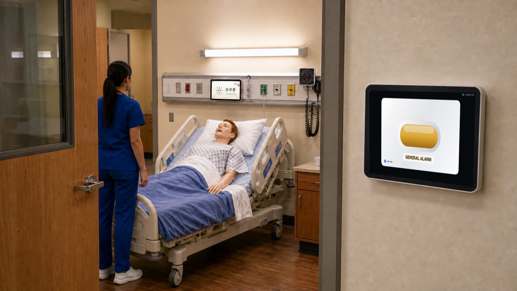 A bedside tablet connected to a General Alarm display in the hallway